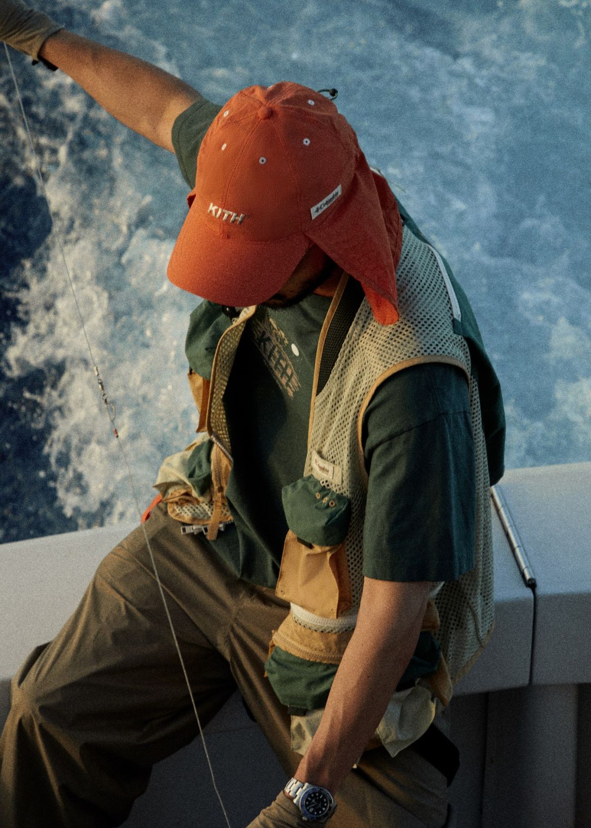 River — orange cap on fishing boat
