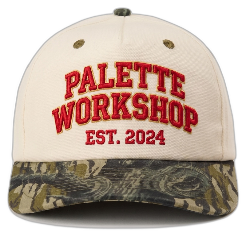 Direct embroidery on cream cap with red varsity lettering